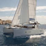 Team enjoying sailing for corporate events near Oahu coastline.