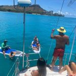 Friends paddle boarding stern