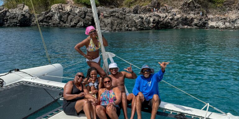 Friends having a multi-day sailing adventure along Big Island coastline.