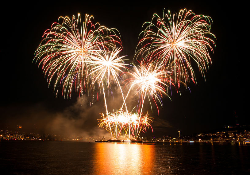 A couple enjoying Friday night fireworks sailing near Oahu.